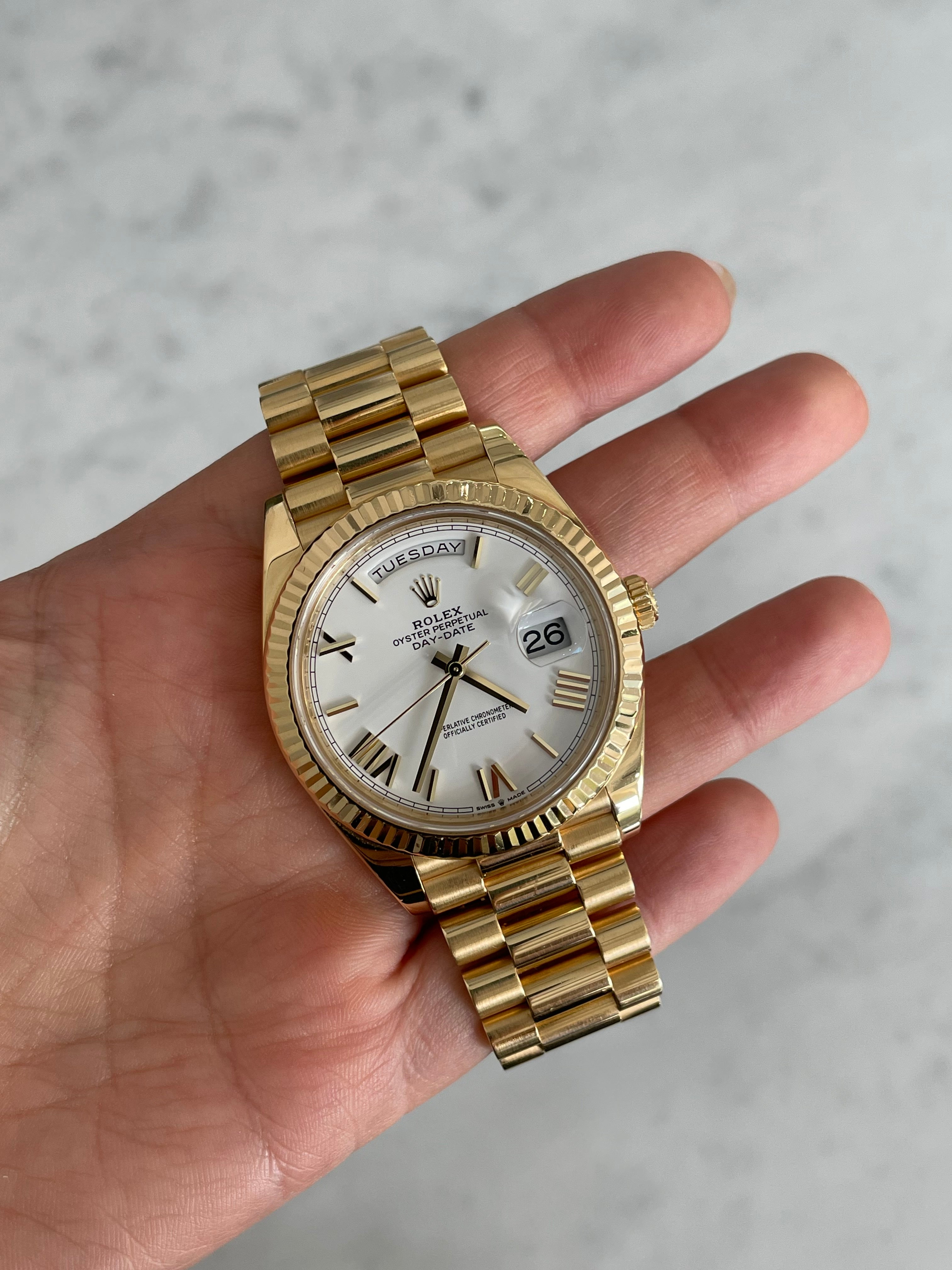 Gold rolex day sales date white face